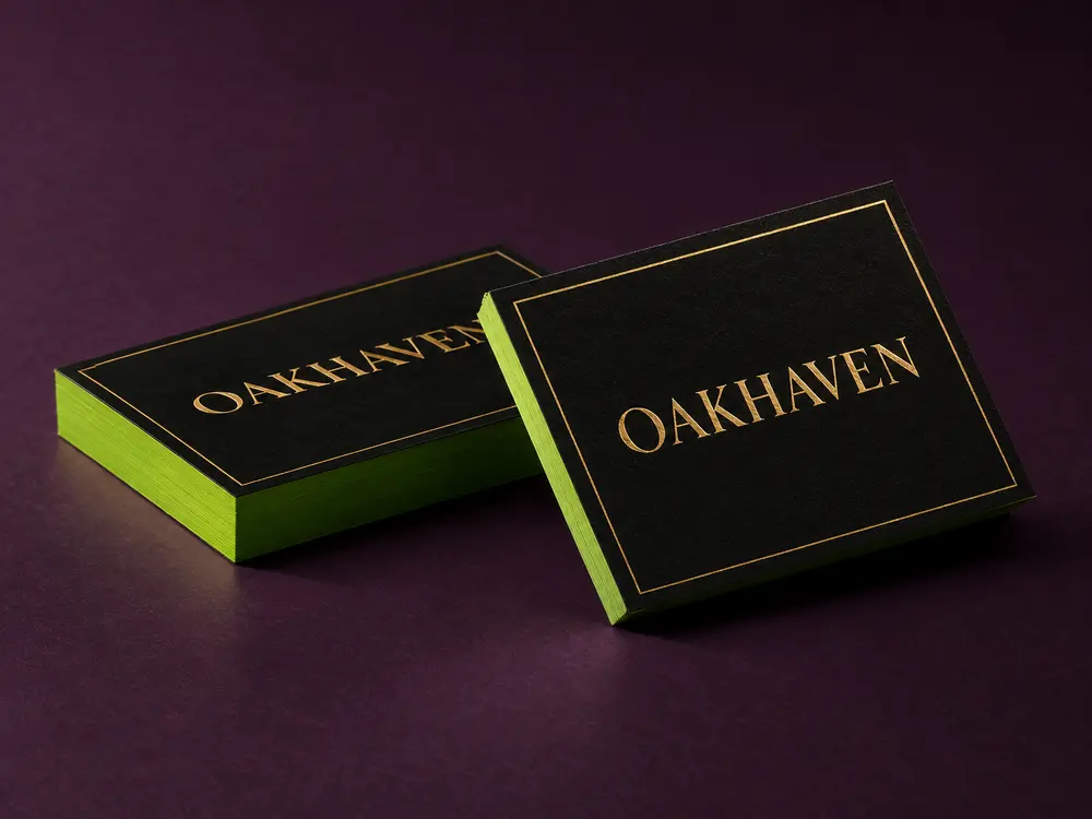 Extra-thick black business cards with gold foil and lime green painted edges