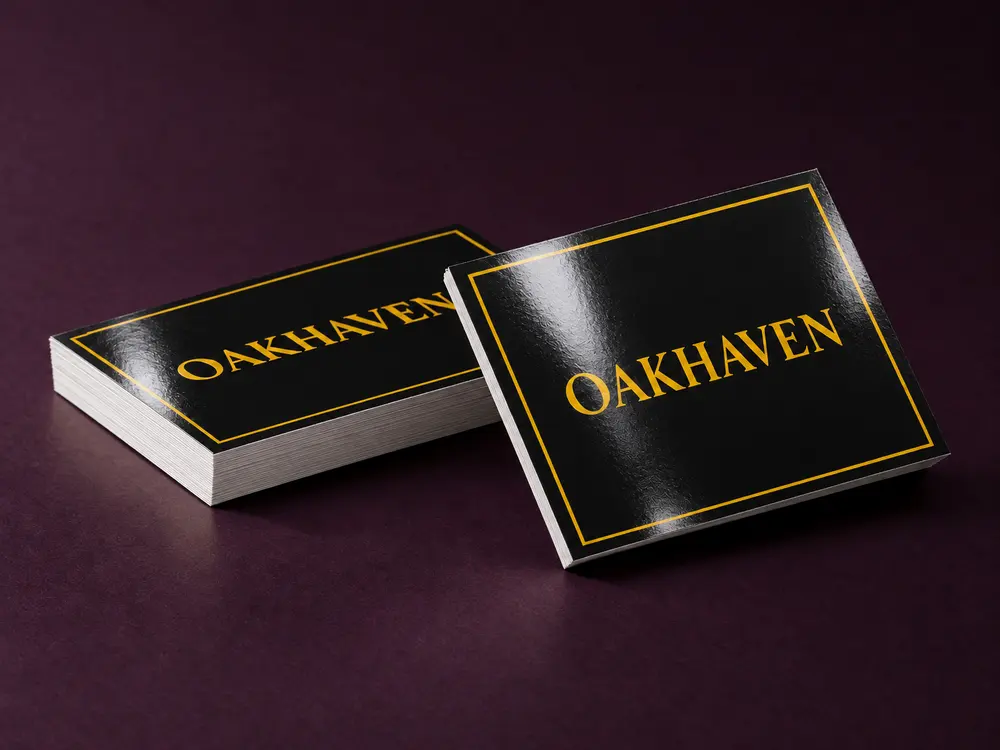 Two thin everyday business cards with a shiny gloss coating